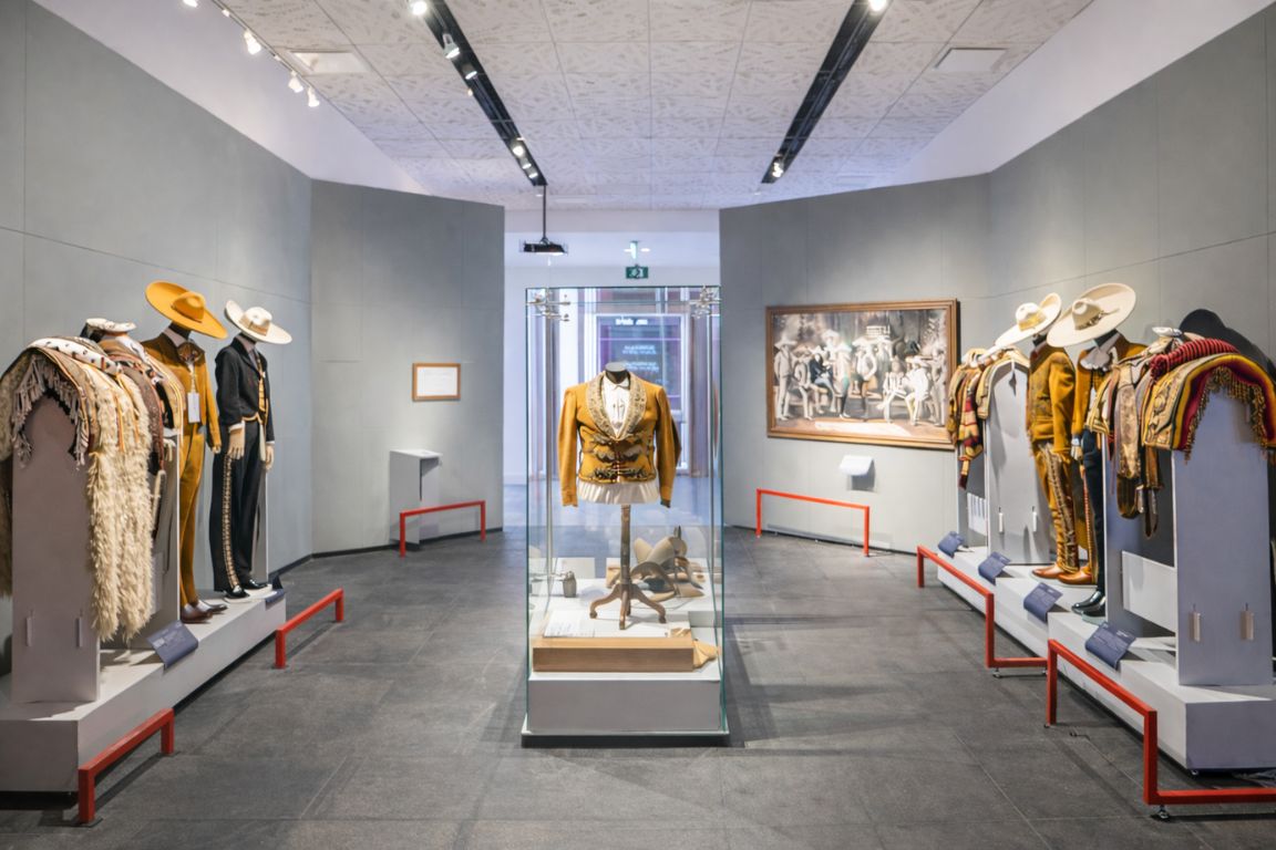 Juan Beckmann Gallardo Cultural Center museum interior in Tequila Jalisco displaying traditional charro outfits, visited during a guided tour with Guadalajara Tequila Tours