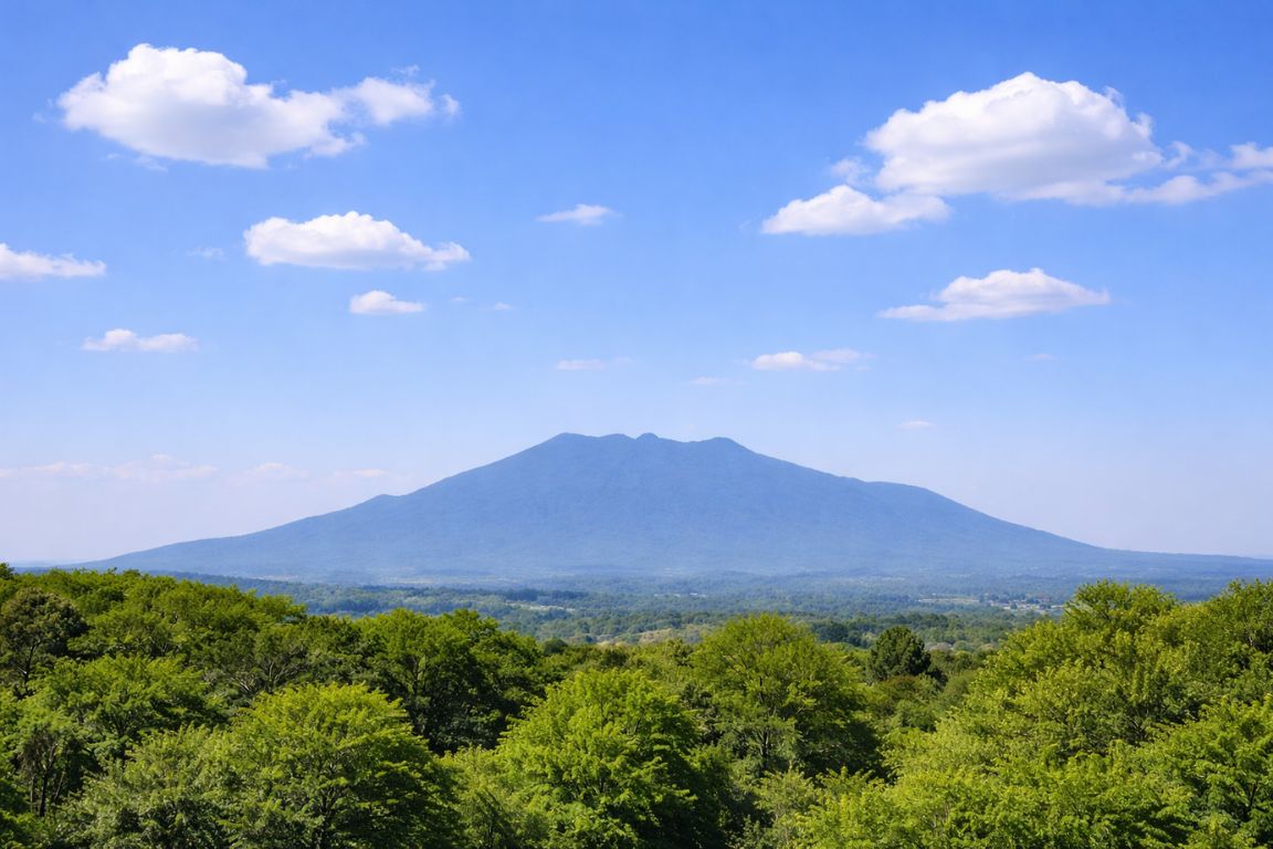 Scenic view of Tequila Volcano surrounded by green valleys and forests in Jalisco, captured during a Guadalajara Tequila Tours experience
